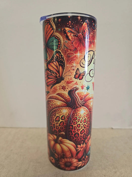 Decorative cylindrical object with butterfly and leopard print design on a plain background