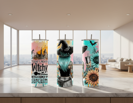 Three Tumblers with Halloween-themed designs featuring a witch, sunflowers, and a castle.