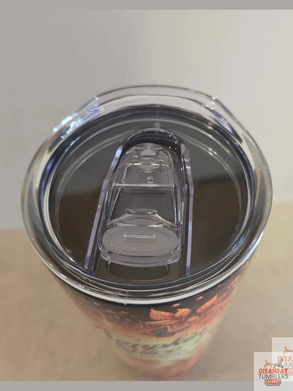 Close-up of a tumbler with a clear lid on a neutral background