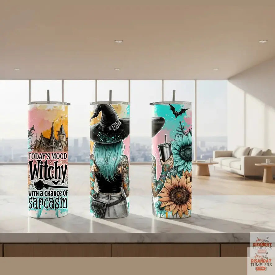 Three Tumblers with Halloween-themed designs featuring a witch, sunflowers, and a castle.